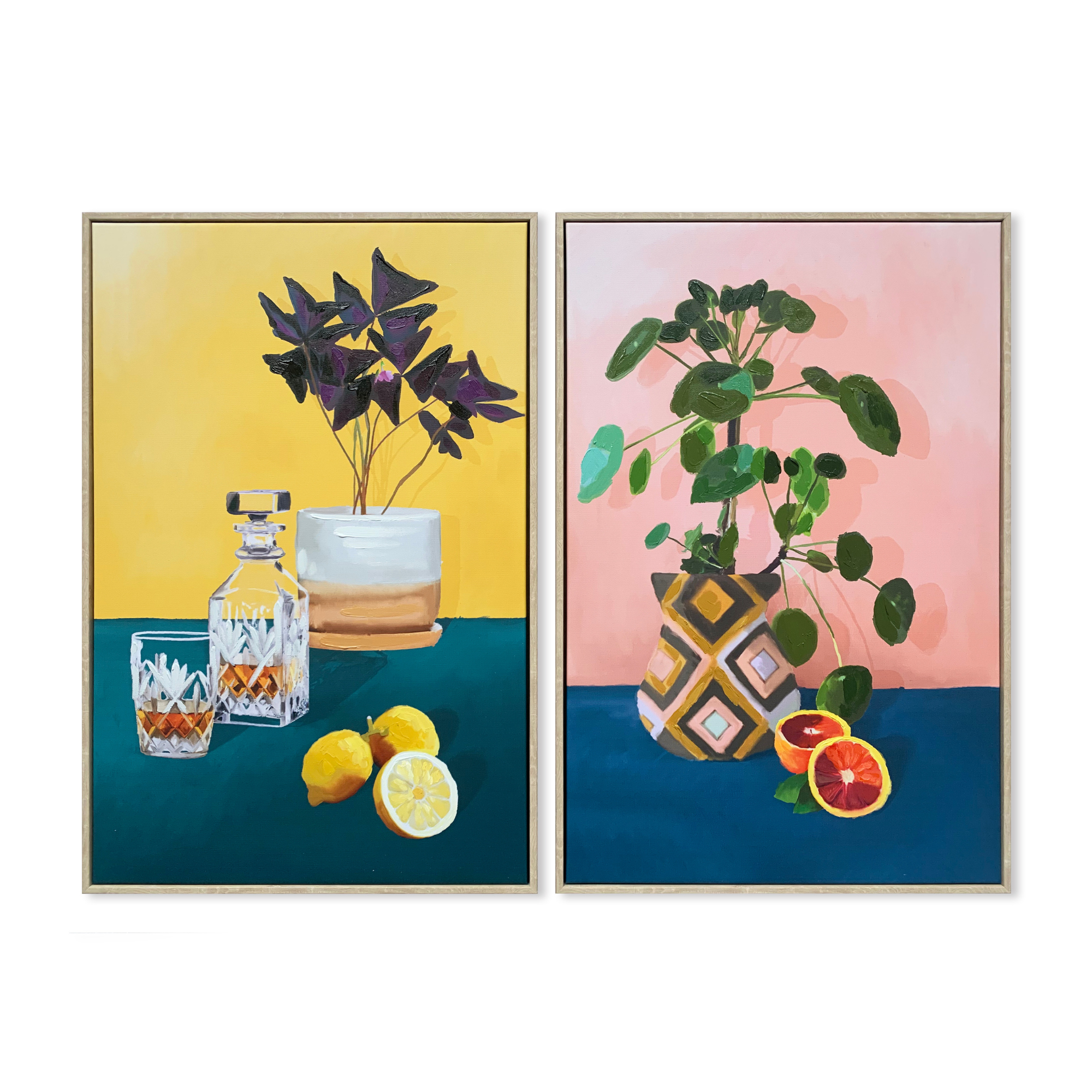 Set of two Good Things artworks, featuring vibrant fruits and plants in 40cm x 60cm timber look frames."