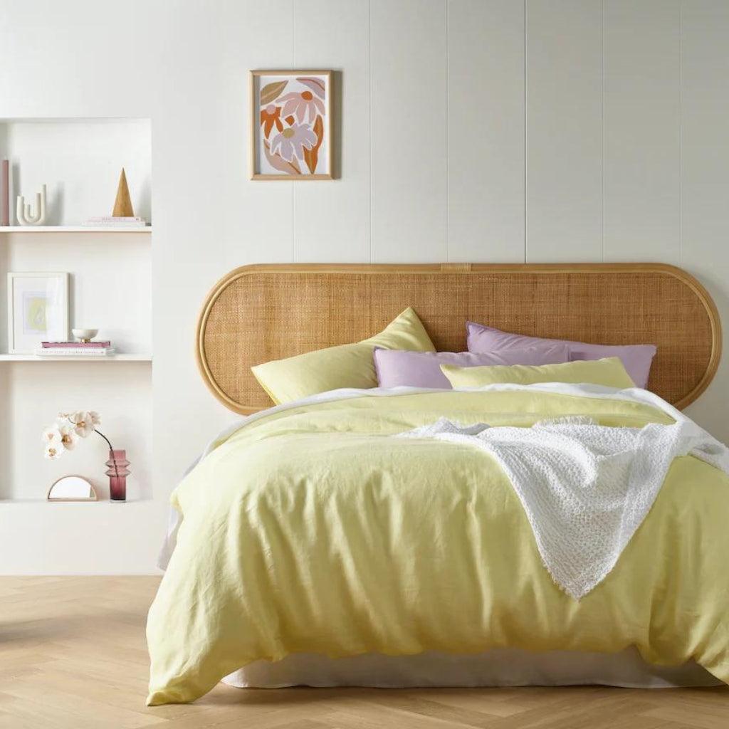 The King Size Butter Yellow French Linen Quilt Cover Set laid out in a spacious bedroom, creating a tranquil sleep sanctuary.