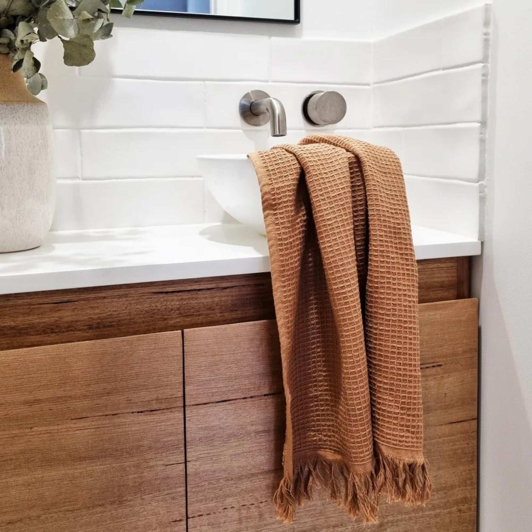 Set of 2 Camila Waffle Hand Towels in Earth, versatile for both kitchen and bathroom use.