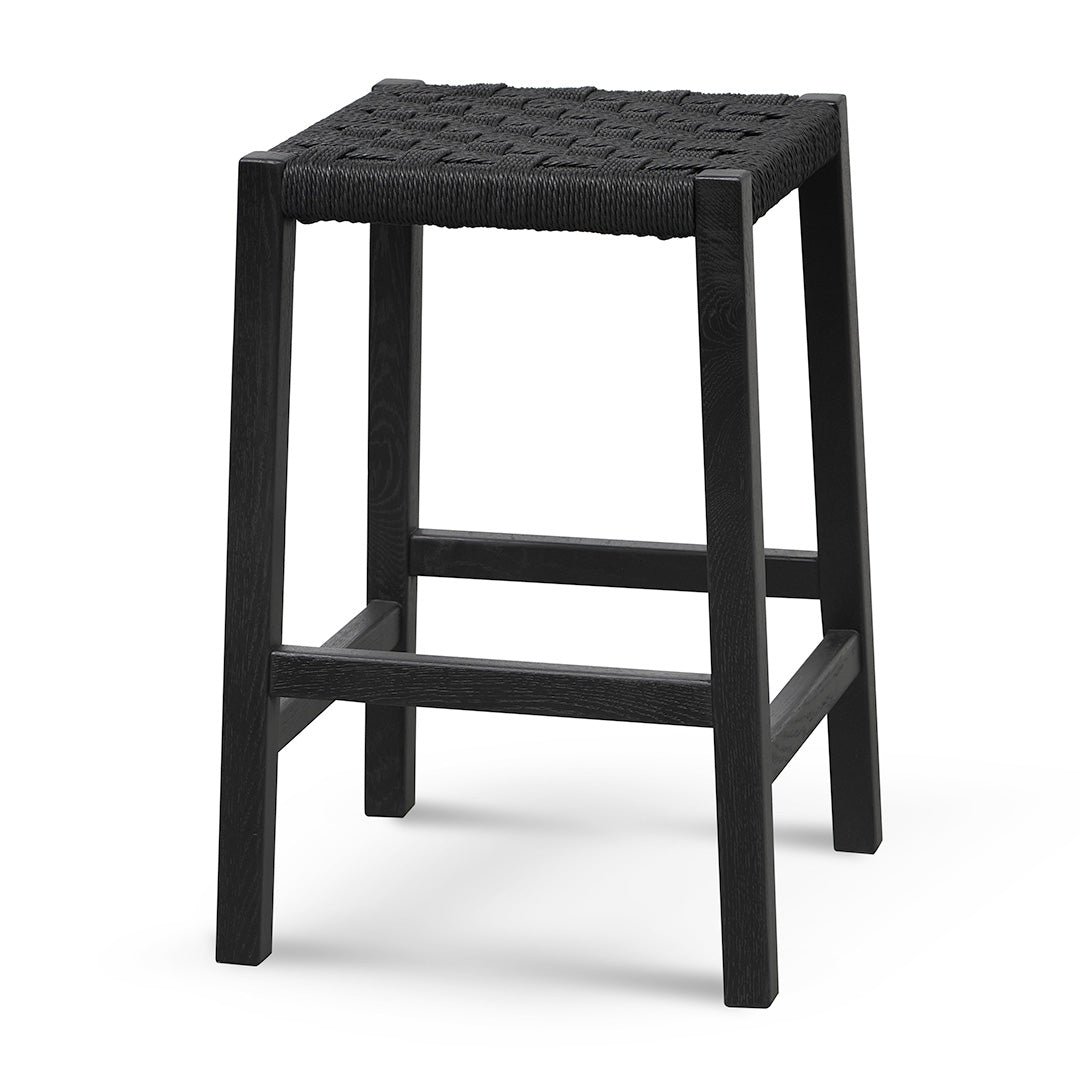 Side view of Esther Barstool featuring black oak wood and handwoven paper cord seating.